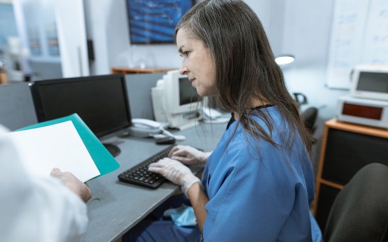 Nurse entering in medical information