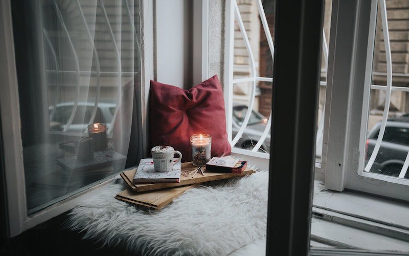 cozy reading spot next to a window