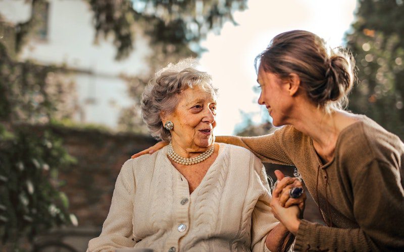 senior mom and adult daughter